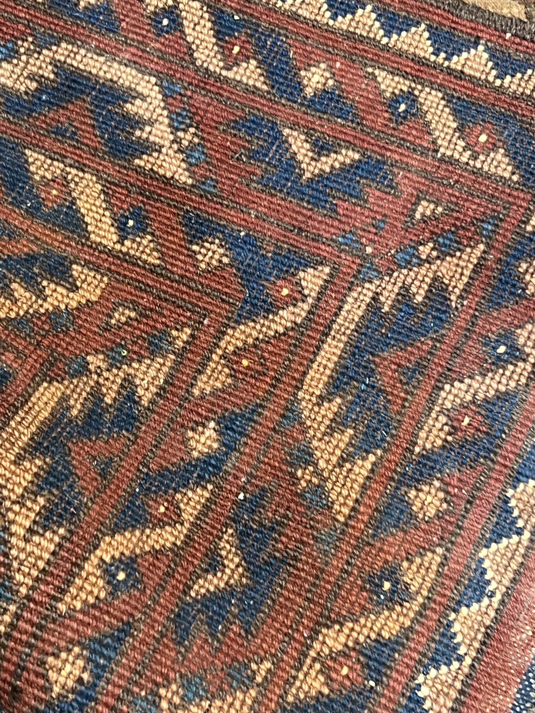 A Tekke red ground rug, 150 x 90cm